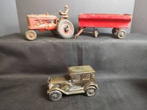 lot 693 image: Vintage Cast Metal Bank with Metal M Tractor and Trailer