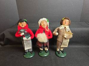 lot 758 image: Byers Choice The Carolers Set of 3 Singing Figurines 1987, 1988, and 1996