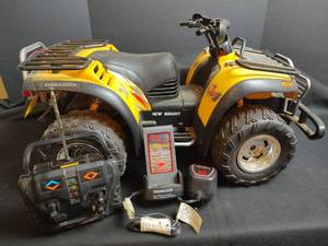 lot 826 image: New Bright Bombardier ATV RC Quad 9.6V NiMH with Charger and Remote