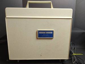 lot 831 image: Vintage General Electric Deluxe Automatic Portable Record Player, Powers On