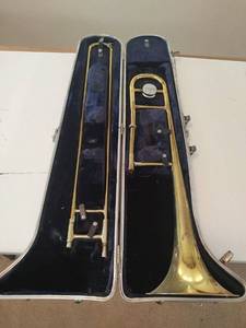 lot 857 image: CONN Trombone with Hard Case and Head Start Combos Saxophone Book