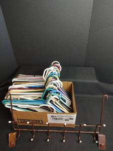 lot 908 image: Plastic Clothes Hangers and Overdoor Hanger