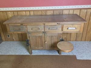 lot 956 image: Antique E.H. Sheldon & Co. Muskegon Michigan Laboratory Table with 4 Drawers, Cabinet Storage, and 1 Swing out Stool