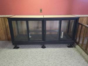 lot 957 image: Antique Black Glass Display Cabinet, 4-Door Sliding Glass Front (See Pics For Glass Damage)