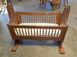 lot 1532 image: Handmade Solid Oak Rocking Cradle with Turned Spindles (has locking Setting)