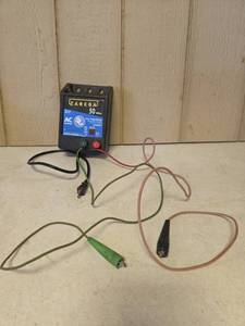 lot 1557 image: Zareba 50 Miles Low Impedance AC Powered Electric Fence Controller EAC50M-Z