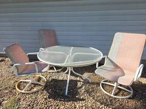 lot 2000 image: Patio Dining Set Round Glass Table with 3 Sling Swivel Chairs