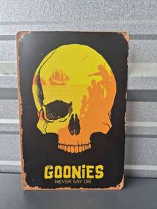 lot 266 image: The Goonies Never Say Die Skull Metal Sign