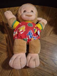 lot 311 image: Playskool Plush Doll with Red Holiday Print Outfit 1991