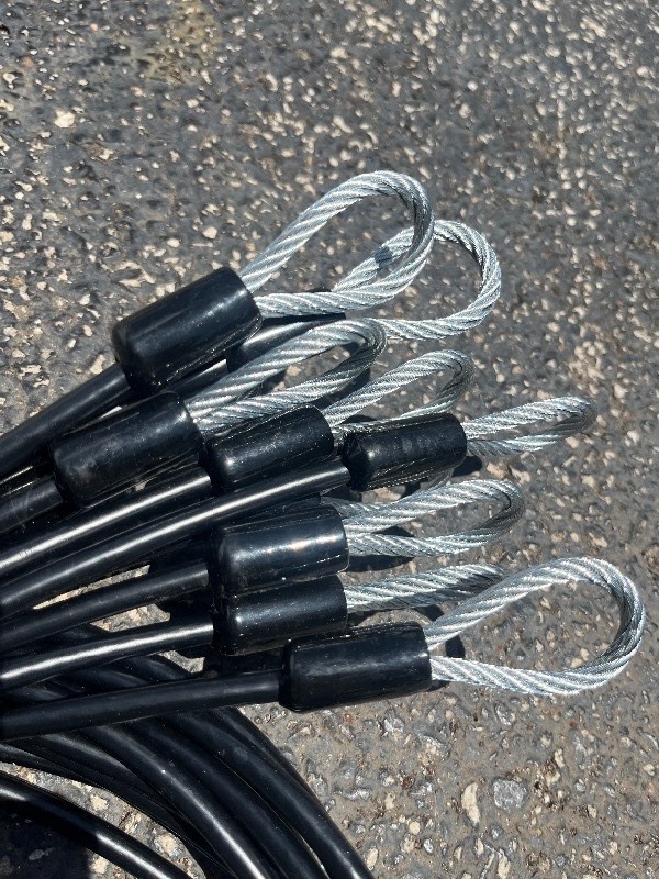 lot 219 image: Bundle of 10 Braided Steel Cables W Looped End  - Black rubber coating