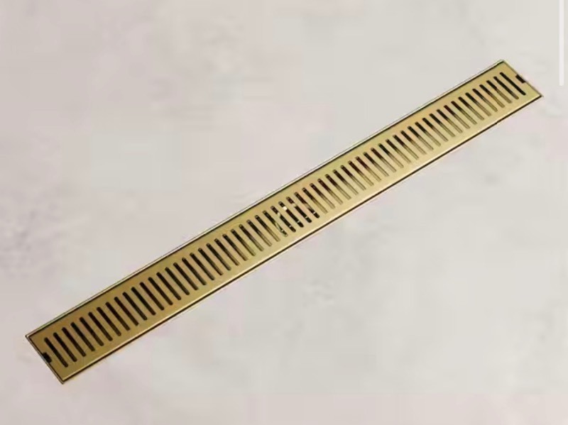 lot 191 image: 24 in Linear Shower Drain in Matte Brushed Gold Retails $99