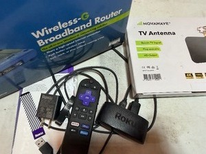 lot 246 image: Linksys Router, Novaware TV Antenna, Roku Media Player
