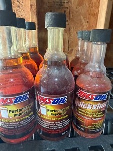 lot 262 image: AMSOIL Performance Improver (6) and Quick Shot (3) Gasoline Additives