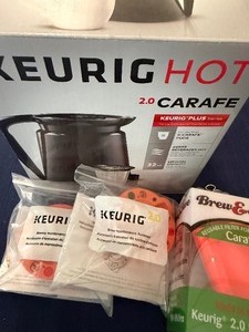 lot 403 image: Keurig Carafe and Accessories and a Cutting Board