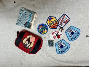 lot 36638 image: Looney Tunes Coin Bag - Full of Bowling Patches & Pins.