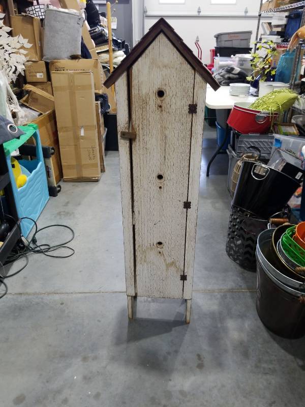 lot 2557 image: Tall Wooden Shelving Cabinet with House-Shaped Top and Dark Trim