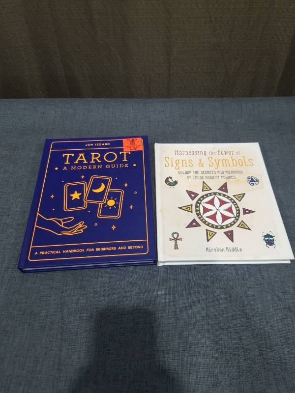 lot 2600 image: Tarot A Modern Guide by Jon Izzard and Harnessing Power of Signs & Symbols by Kirsten Riddle 2 Books