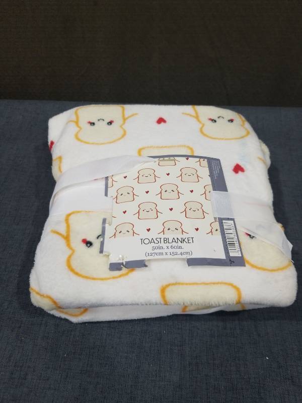 lot 2728 image: Toast Blanket 50in. x 60in. (127cm x 152.4cm)
