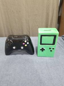 lot 1320 image: Gaming Controller and Handheld Console Shaped Coin Banks Set of 2