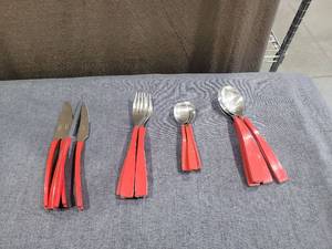 lot 1438 image: Gibson Stainless China Flatware Set Red Handles