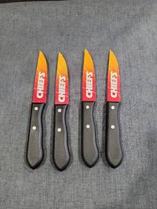 lot 1439 image: Kansas City Chiefs 4-Piece Steak Knife Set with Red and Yellow Blades