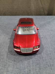 lot 1455 image: Diecast Model Car Red Sedan Scale 124 NO.90372