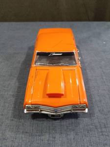 lot 1465 image: 1965 Chevy Malibu Orange Die-Cast Model Car with Opening Hood and Engine Detail Hood Is Cracked See Pictures