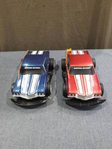 lot 1469 image: New Bright Super Sport RC Cars Pair Blue Red 6.0V NiCd Battery No Remote