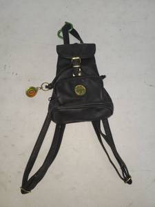 lot 34 image: Coach Black Backpack with Brass Hardware and Charm