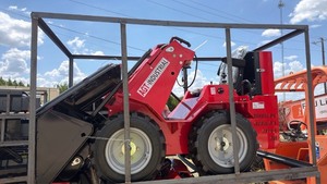 lot 7042 image: AGT MINI skid steer WITH TIRES and bucket attachment 420cc