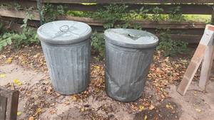 lot 303 image: Two Metal Trash Cans with Lids