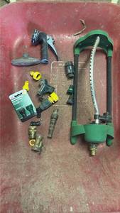 lot 320 image: Garden Hose Watering Lot with Sprinkler Head, Nozzles, and Connectors