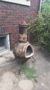 Chiminea with Decorative Relief and Metal Stand