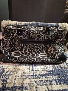 lot 137 image: bebe Monogram Rolling Carry-On Luggage Black