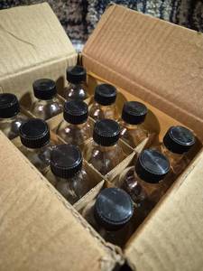 lot 174 image: Glass Bottles with Black Screw Caps and Dropper Tops Lot of 12