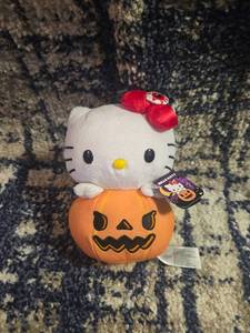 lot 413 image: Hello Kitty Pumpkin Plush Toy with Red Bow Tag