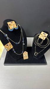lot 111 image: Fashion Jewelry with Blue Stone Necklace, Gold Swirl Rhinestone Embellished Necklace, and Earrings