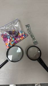 lot 119 image: Magnifying Glasses, Bag of Beads, and a beaded Apple Watchband