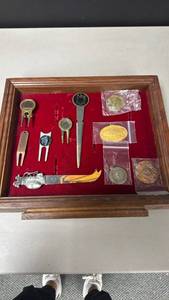 lot 120 image: Golf Collectibles Lot with Coins, Divot Tools, Divot Tool Money Clip, Letter Opener and Wood Belt Buckle Display Box