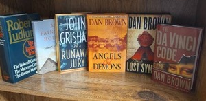 lot 706 image: Lot of 6 Books Dan Brown, John Grisham, Robert Ludlum Novels (books may or may not have an Ex Libris this Book Belongs To sticker on first page)