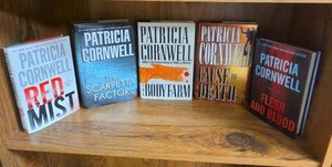 lot 709 image: Patricia Cornwell 5 Book Lot including first editions of The Body Farm and Cause of Death (books may or may not have an Ex Libris this Book Belongs To sticker on first page)
