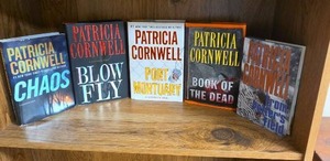 lot 710 image: Patricia Cornwell 5 Book Lot including first editions of Blow Fly, Port Mortuary and Book of the Dead (books may or may not have an Ex Libris this Book Belongs To sticker on first page)