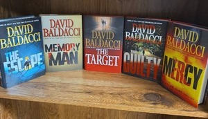 lot 711 image: David Baldacci 5-Book Lot The Escape, Memory Man, The Target, The Guilty, and Mercy - all are first editions  (books may or may not have an Ex Libris this Book Belongs To sticker on first page)