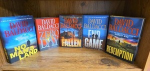 lot 712 image: David Baldacci 5 Books No Mans Land,  The Fallen, End Game, Redemption are all first editions.  Zero Day is not first ed.  (books may or may not have an Ex Libris this Book Belongs To sticker on first page)