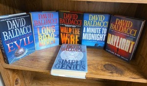 lot 713 image: David Baldacci 6-Book Lot Deliver Us From Evil, Long Road to Mercy, Walk the Wire, Minute to Midnight, Daylight, Simple Genius - all first editions  (books may or may not have an Ex Libris this Book Belongs To sticker on first page)