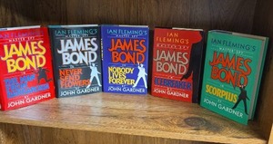 lot 716 image: Ian Flemings James Bond Master Spy Books by John Gardner - all first editions except for Scorpius (no ex libris stickers inside)