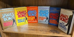 lot 717 image: Ian Flemings James Bond Master Spy Series 6 Books by John Gardner - four of them are first editions  (books may or may not have an Ex Libris this Book Belongs To sticker on first page)