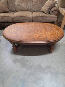 lot 7 image: Oval Coffee Table with Inlay Top and Turned Legs. 52 W x 32 D x 16H - has some minor bubbling on the inlay portion of the top (hard to see if photos)