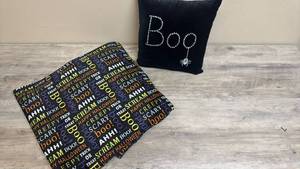 lot 513 image: Halloween Themed Pillow and Fleece Blanket. Lot of 2 Pieces