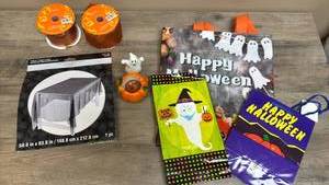 lot 515 image: Halloween Party Supplies Lot Decorations, Tableware, Orange Ribbon and gift bags